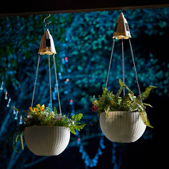 Glitzhome® 30" White Solar Lighted Hanging Plastic Basket Planters, 2ct.